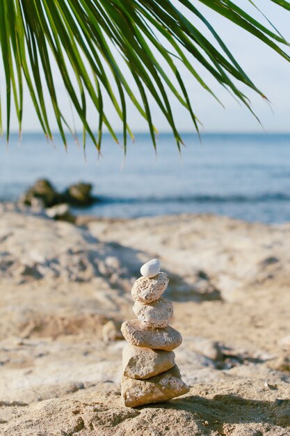 Pebble pyramid on the seashore