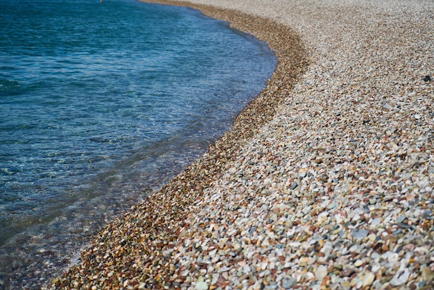 Pebble stone and sea background