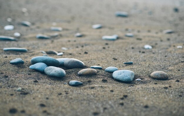 Pebble stones in the sand by the sea