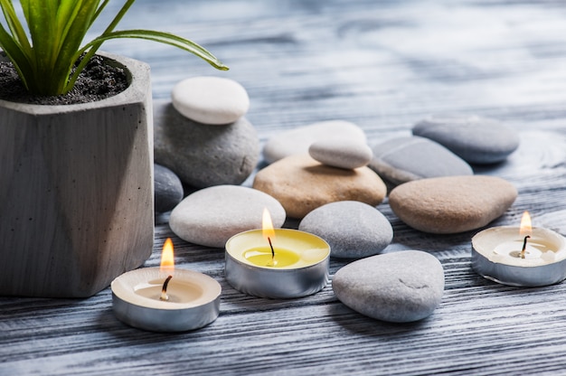 Pebbles and lit candles