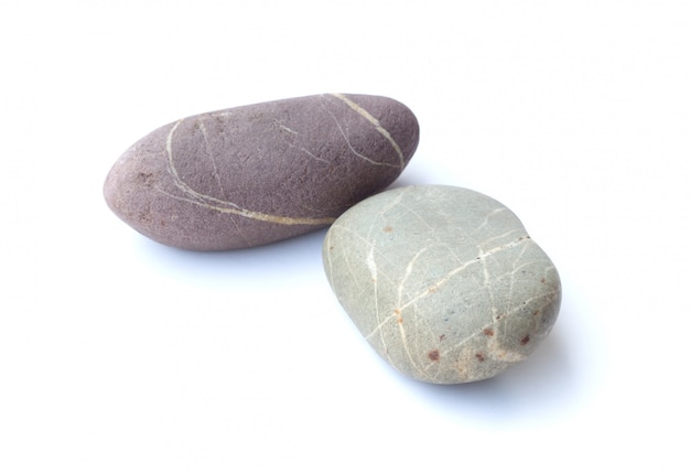 小石石、白い背景で隔離の石のヒープ