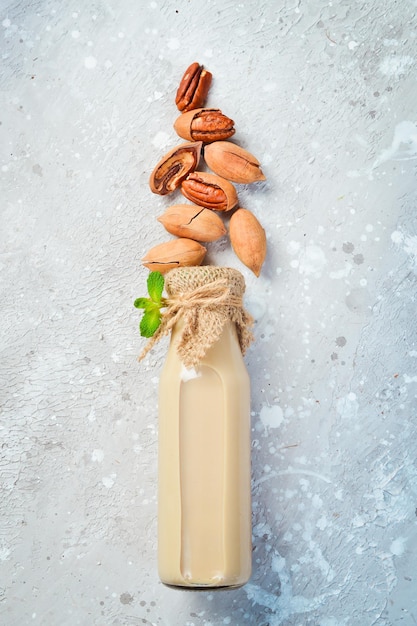 Photo pecan nut milk. dairy free, lactose free milk. top view. vegan drinks.