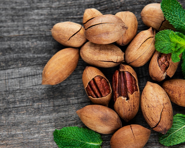 Pecan nuts on a old wooden table