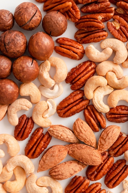 Pecans brazil nuts cashews almonds and macadamia nuts pattern.