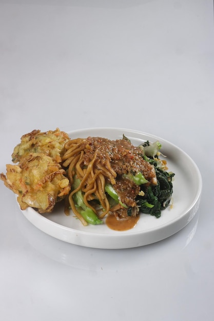 Pecel Mie or Bakmie Pecel is Javanese Salad Made of Vegetables and Fried Noodle with Peanut Sauce