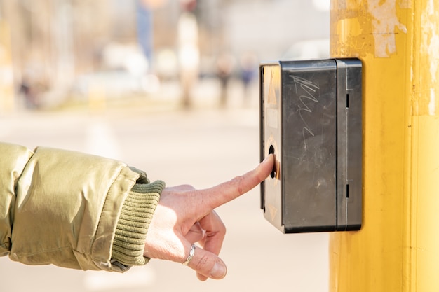 pedestrian button on a city street crossing