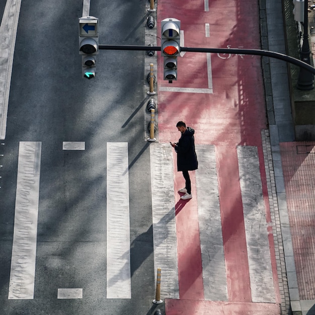 pedestrian crossing the crosswalk in Bilbao city, Basque country, Spain