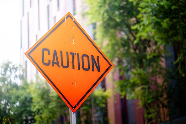 Pedestrian crossing sign under construction with orange color