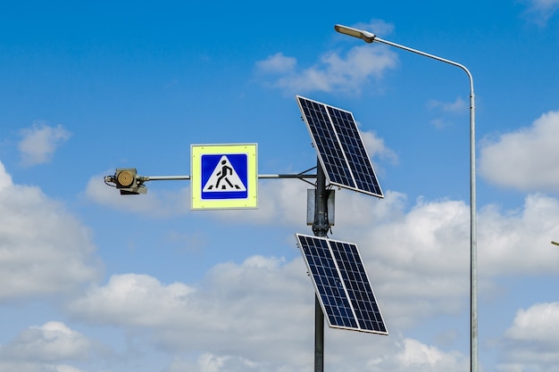 The pedestrian crossing sign powered by solar panels installed\
above traffic signs and rules