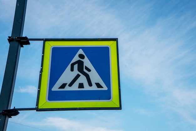 Pedestrian crossing signon blu sky. High quality photo