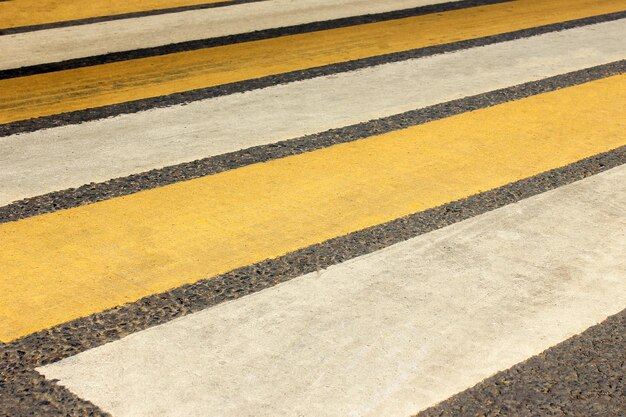 Pedestrian crossing with white and yellow lines