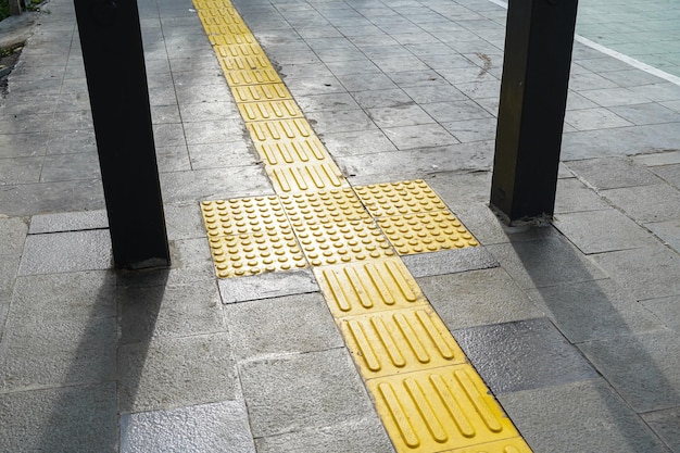 Pedestrian paths, Braille block in tactile paving for the blind handicapped in tiled pathways