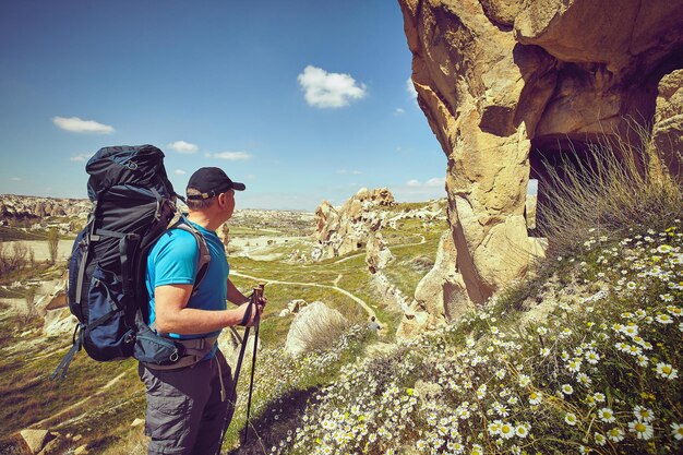 Pedestrian tourism, people travel with backpacks, in the open air.