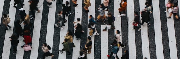 Pedestrians crossing a crosswalk in Shibuya, Japan