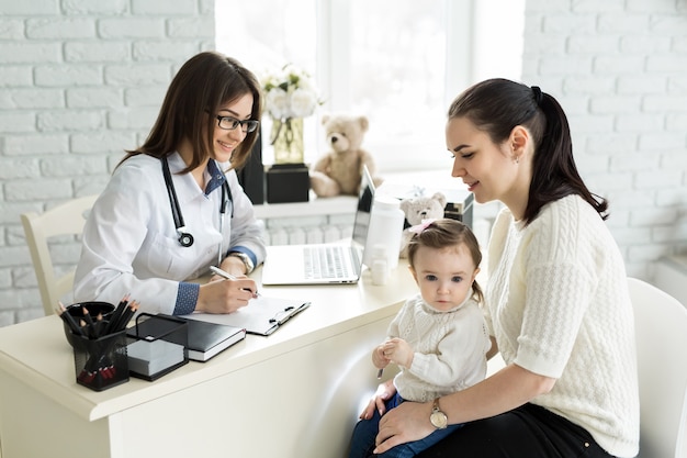 Pediatrician meeting with mother and child