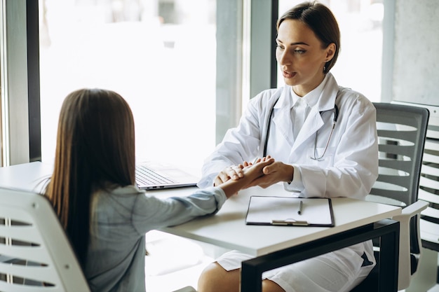 Pediatrician with child having consultation