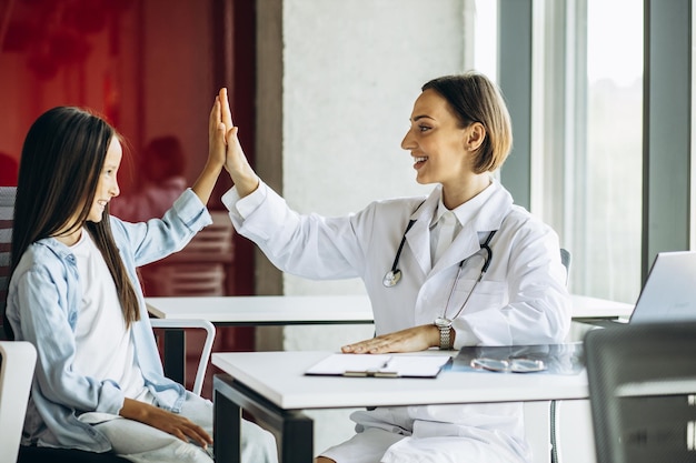 Pediatrician with child having consultation