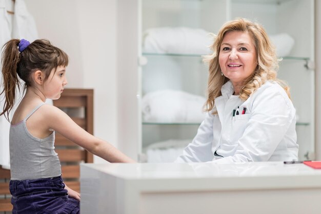 Pediatrician with little girl