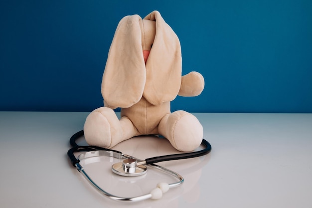 Pediatrics Bunny with a stethoscope on a blue background