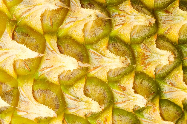 Foto buccia di ananas colore giallo. estratto di texture