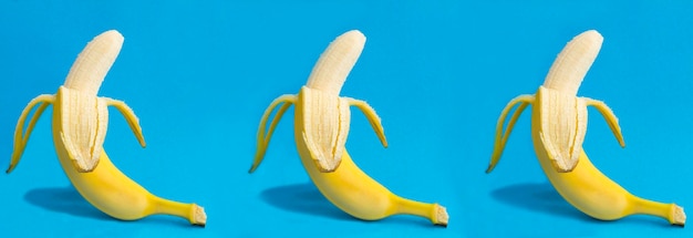 Peeled banana on the blue background Closeup