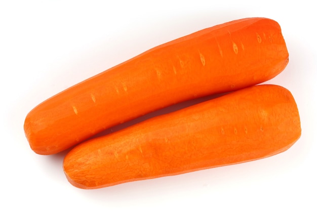 Peeled carrots on a white surface