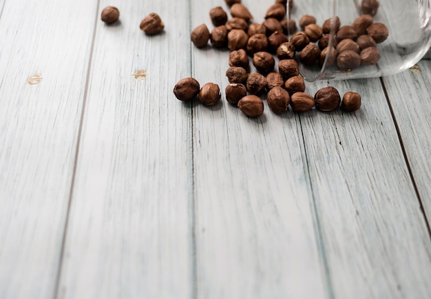 Peeled hazelnuts on background