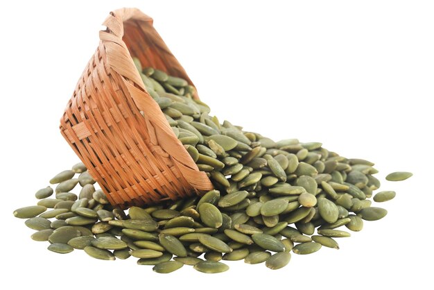 Peeled organic pumpkin seeds in basket