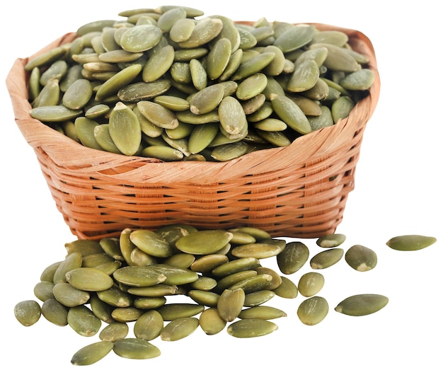 Peeled organic pumpkin seeds in basket