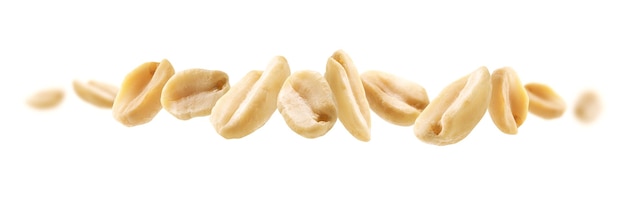 Photo peeled peanuts levitate on a white background