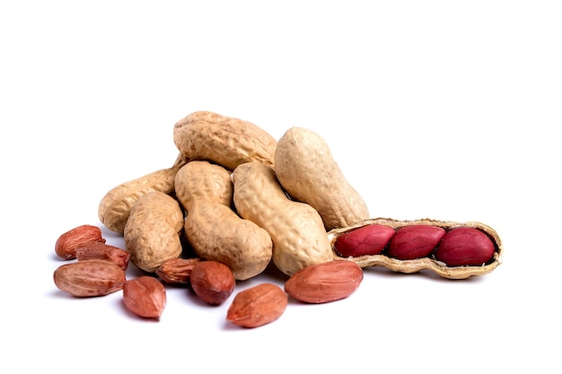 Peeled peanuts and peanut pod isolated on white background.