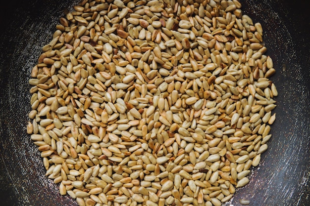 Peeled roasted seeds in a steel pan