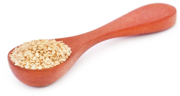 Peeled sesame seeds in a wooden spoon