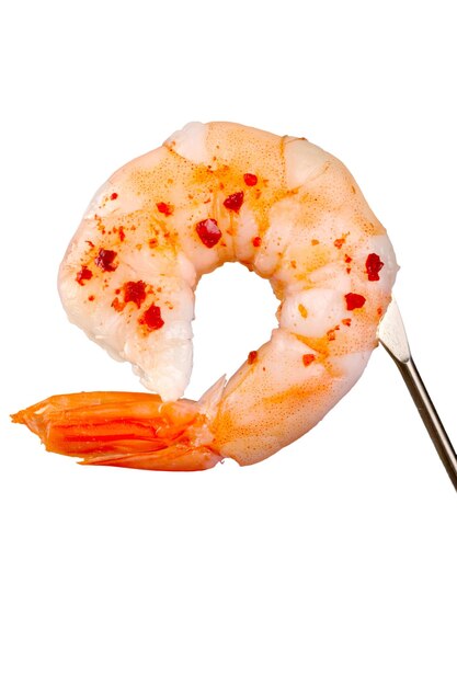 Peeled shrimp on a fork isolated on white background