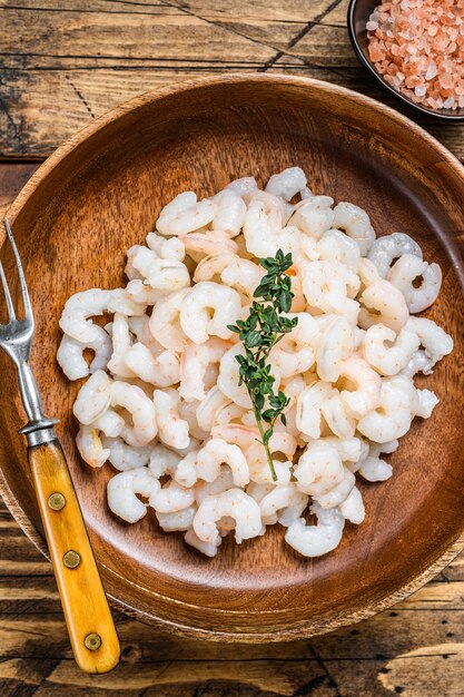 Peeled Shrimps, Prawns in a wooden bowl. 