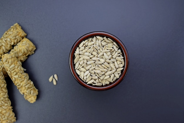 Peeled sunflower seeds   on a gray background