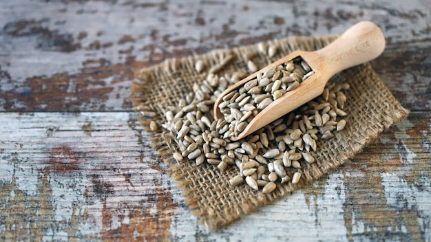 Peeled sunflower seeds in a wooden spatula