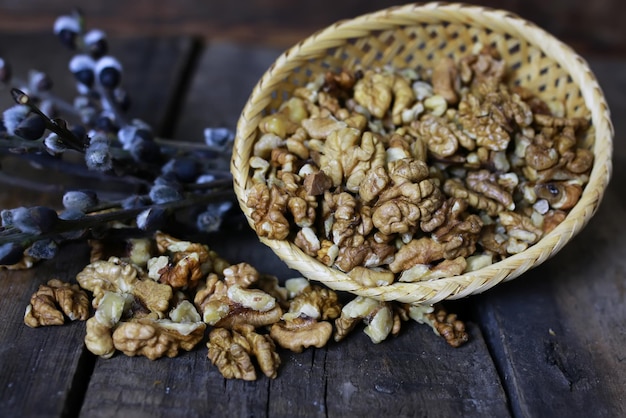 Peeled walnut on a wooden background