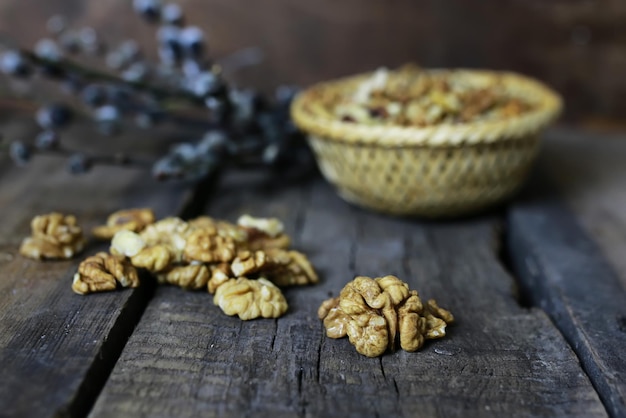 Peeled walnut on a wooden background