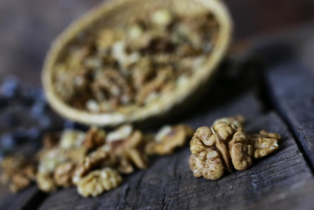 Peeled walnut on a wooden background