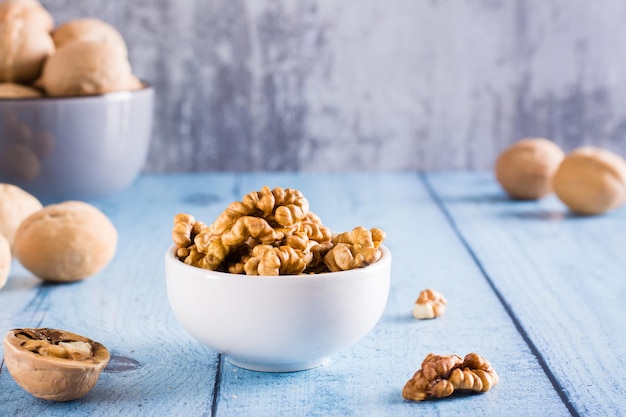 Peeled walnuts in a bowl on the table Organic food