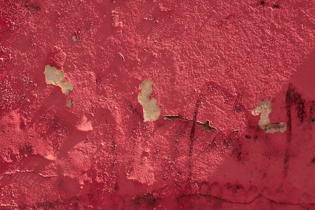 Peeling old red wall texture.