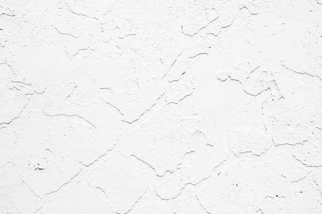 Peeling old white paint on the wall.