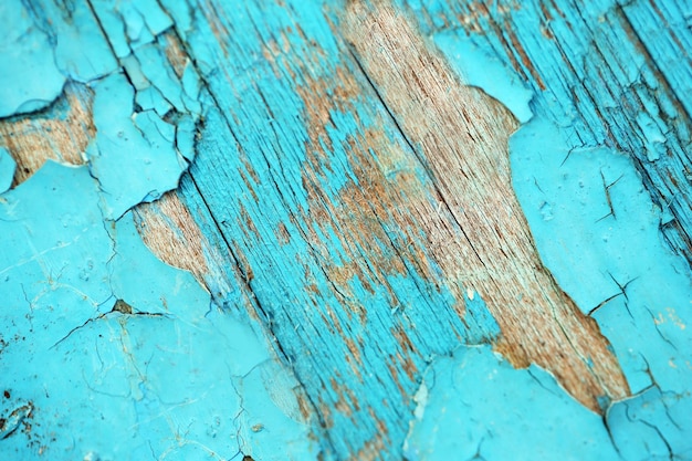 Peeling paint on wooden textured background