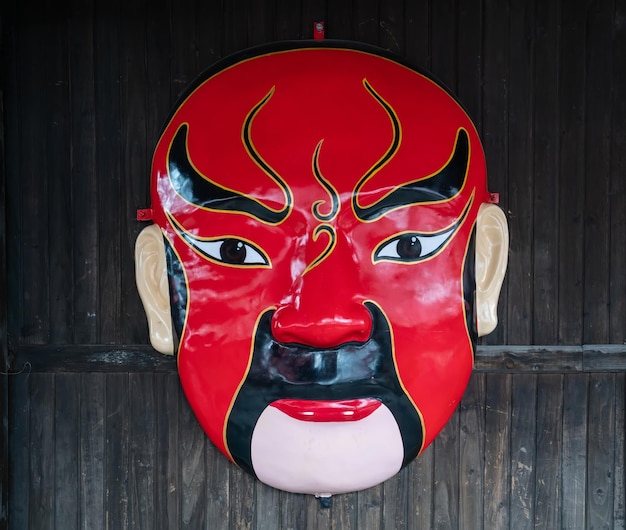 Photo peking opera facial makeup on the wooden wall