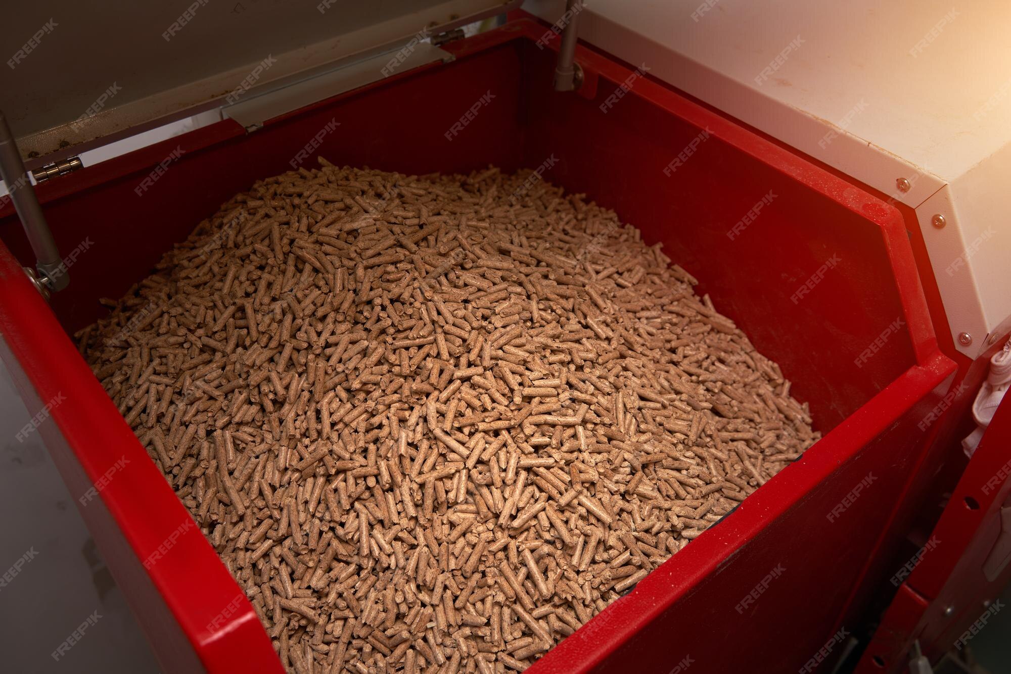 Premium Photo Pellet stove filled with oak pellets alternative fuel