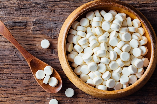 Pelleted milk on wooden table