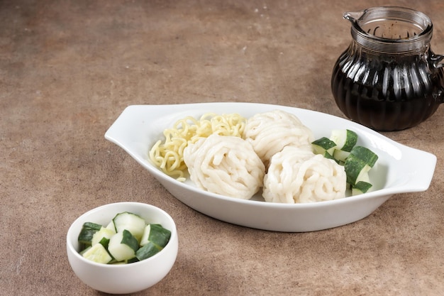 Pempek Keriting Rebus is steamed curly fish cake from Palembang, served with cuko.