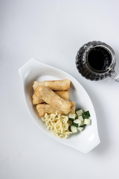 Pempek Lenjer is one of various fish cake from Palembang, South Sumatera served with cuko.