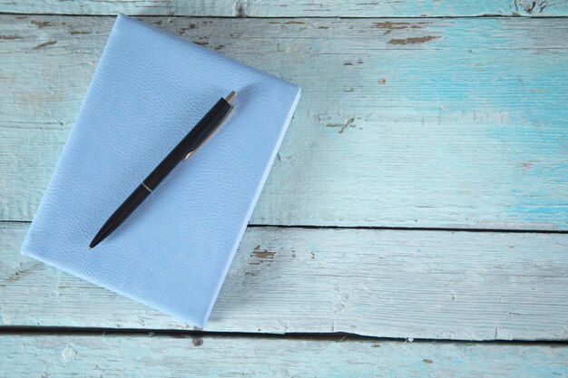 Pen on the blue notepad